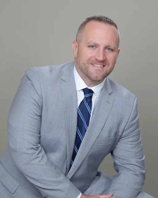 Mr. Clayton Baumann, ASA appraiser or business image